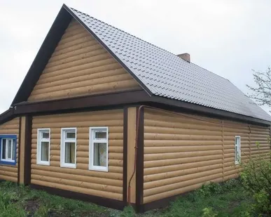 фото Металлический Блок-хаус Геометрия панелей повторяет форму бревна.Granite.