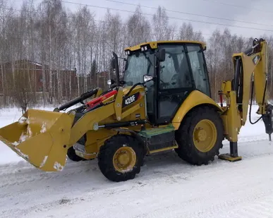 фото Экскаватор CAT 428