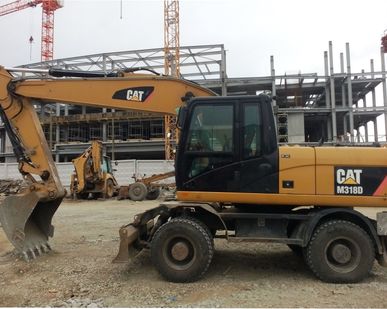 фото Аренда колесного экскаваторов CAT 318D