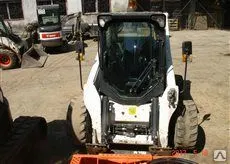 фото Мини-погрузчик BOBCAT A 770 с ковшом и вилами Б/У.