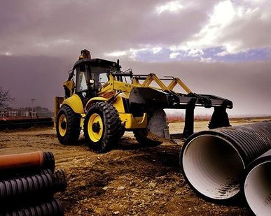 фото Экскаватор-погрузчик New Holland B115B