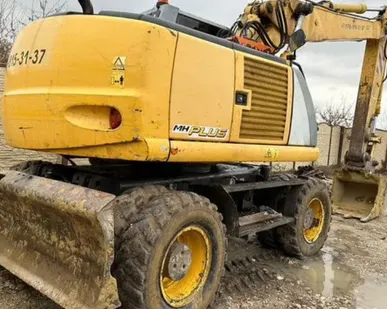 фото Колёсный экскаватор New Holland MH Plus