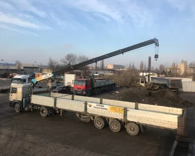 фото Седельный тягач с манипулятором MAN с п/прицепом "шаланда" (гр/п до 20 т, стрела 4 т, вылет 15 м по вертикали)