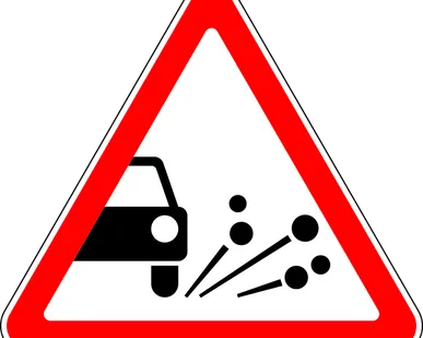 фото Дорожный знак Выброс гравия 1.18