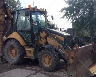 фото Аренда экскаватора-погрузчика Caterpillar 428E, Санкт-Петербург