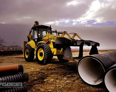 фото Экскаватор погрузчик New Holland B115B.