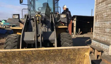 фото Услуги фронтального погрузчика по городу