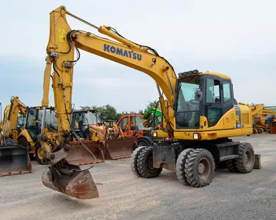 фото Колесный экскаватор Komatsu PW140-7