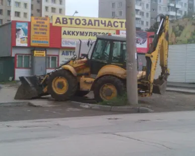 фото Экскаватор погрузчик c молотом