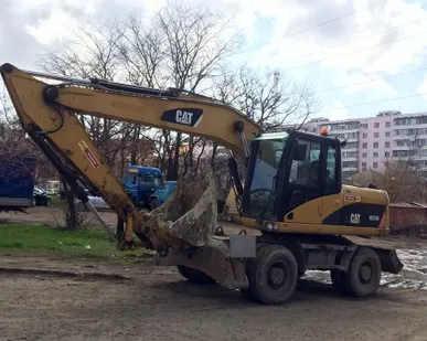 фото Услуги колесного кубового экскаватора Caterpillar