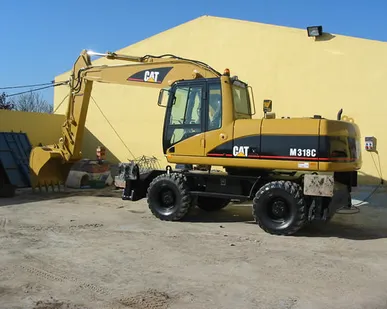 фото Аренда колесного полноповоротного экскаватора с траншейным ковшом