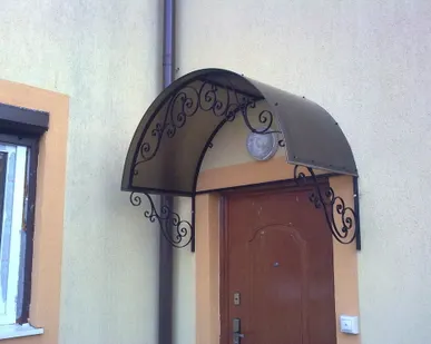 фото Козырек кованый