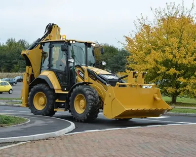 фото Экскаватор погрузчик Caterpillar 434Е + гидромолот