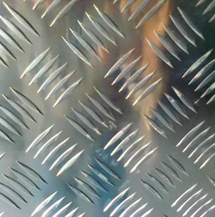 Фото №0 Лист рифленый от 2.5 до 12 мм, ромб, чечевица, 12Х18Н10Т, 09Г2С + резка