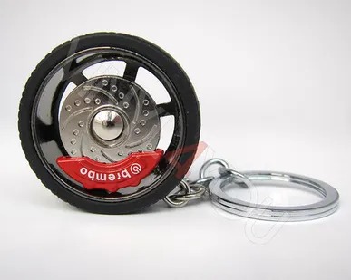 фото Брелок автомобильный диск с шиной серебро