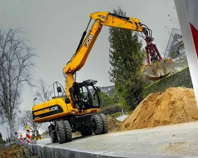 фото Колесный экскаватор с грейфером