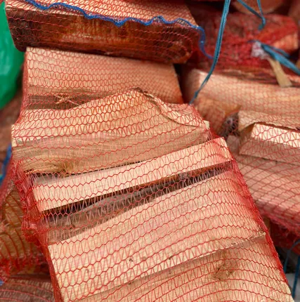 Фото №0 Колотые дрова в сетке