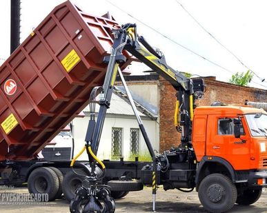 фото Ломовоз КАМАЗ 65115 с манипулятором ОМТЛ-97