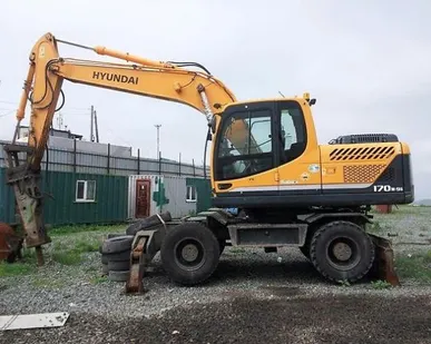 фото Аренда колесного полноповоротного экскаватора с гидромолотом