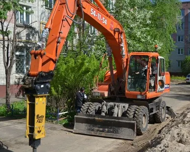 фото Аренда колесного экскаватора с гидромолотом