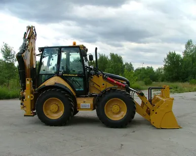 фото Экскаватор Caterpillar с ковшем