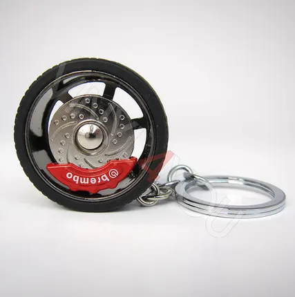 Фото №0 Брелок автомобильный диск с шиной серебро