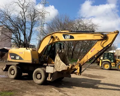 фото Аренда колесного кубового экскаватора Caterpillar