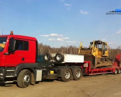 фото Аренда низкорамного трала Man TGA г/п 15т, длина кузова 9.6м